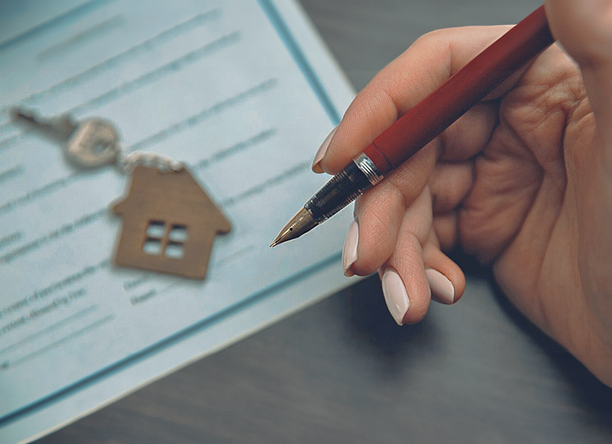 La signature de l'acte de vente d'un bien immobilier.